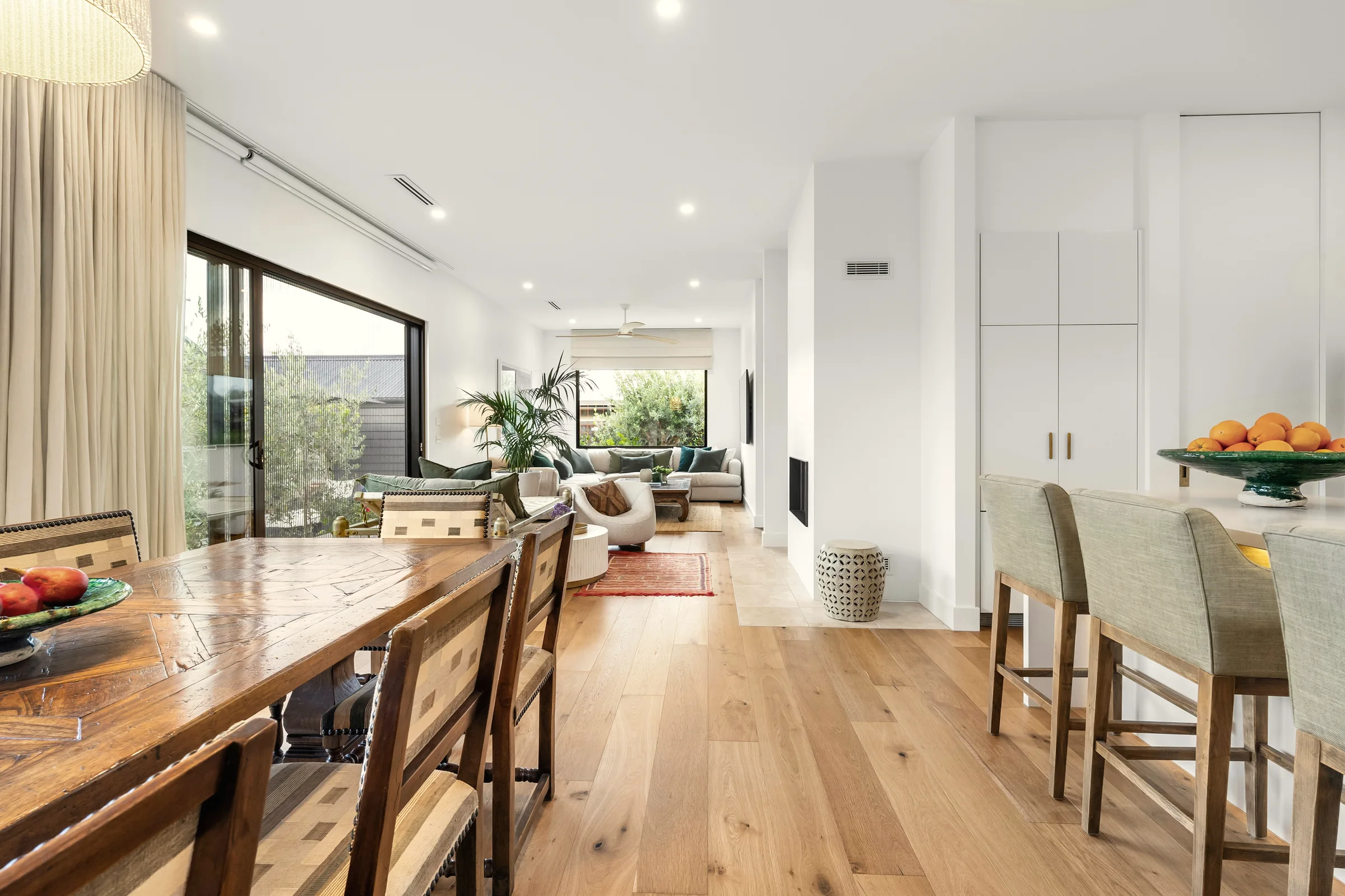 An open-plan kitchen, dining and living room, shown emerging from its floor plan